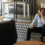 white male business onwer sitting looking stressed out