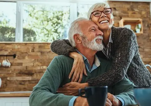 mature-woman-hugging-her-husband